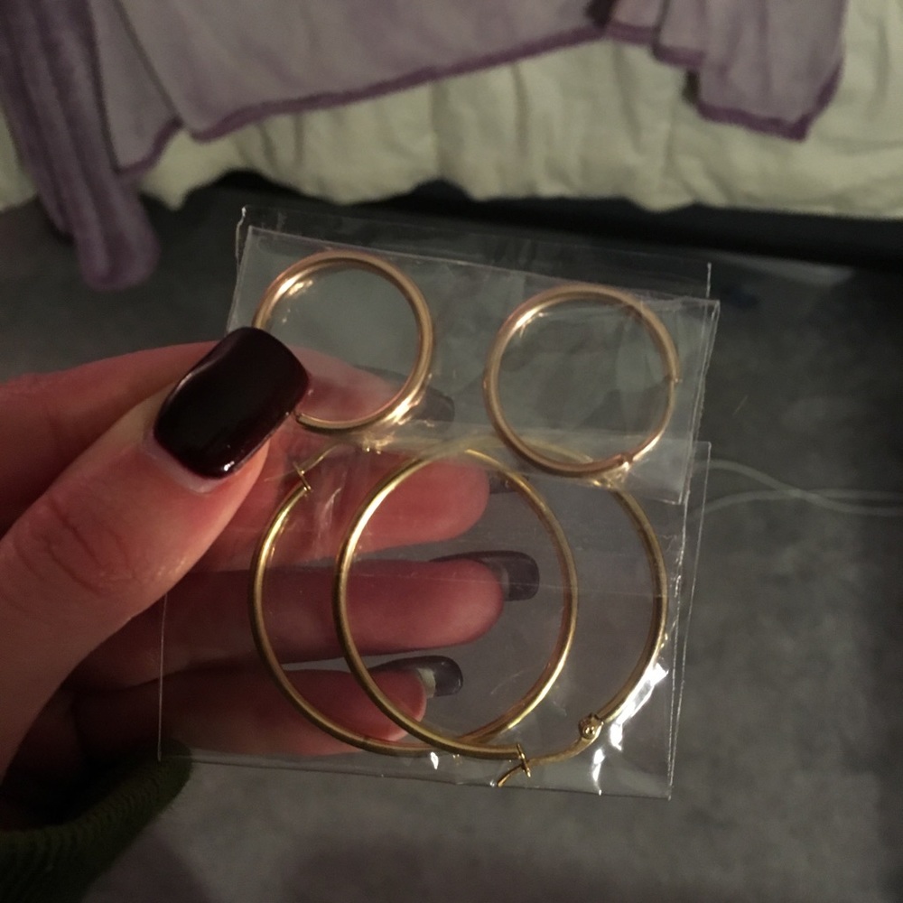 Two Sets of gold hoop earrings